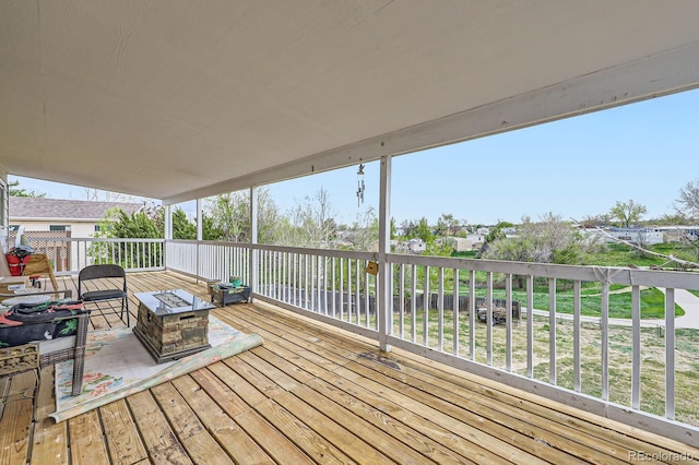 wooden deck featuring a fire pit