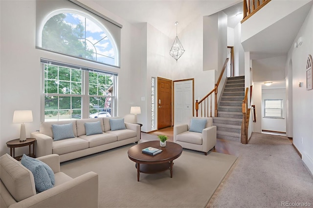 2859 Front Royal Dr, Colorado Springs, CO 80919 - carpeted living room with a high ceiling and stairway