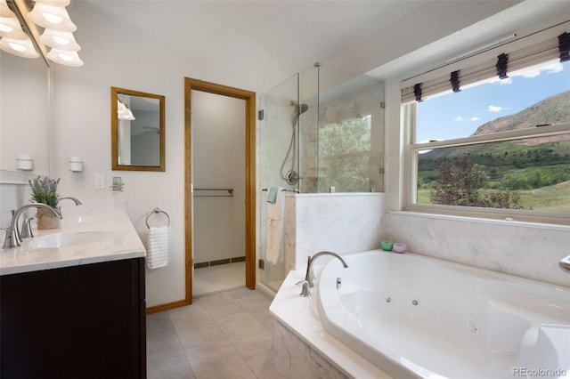 2859 Front Royal Dr, Colorado Springs, CO 80919 - bathroom featuring a stall shower, double vanity, a whirlpool tub, and tile patterned floors