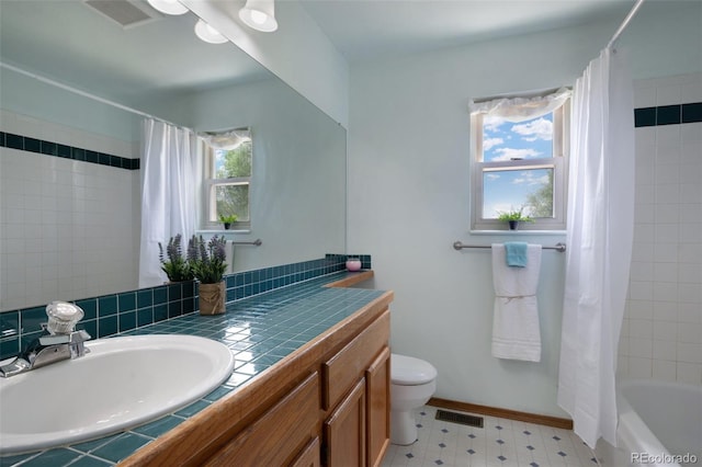 2859 Front Royal Dr, Colorado Springs, CO 80919 - bathroom featuring vanity, tile patterned floors, and shower / bathtub combination with curtain
