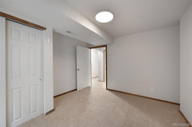2859 Front Royal Dr, Colorado Springs, CO 80919 - unfurnished bedroom featuring light colored carpet and a textured ceiling
