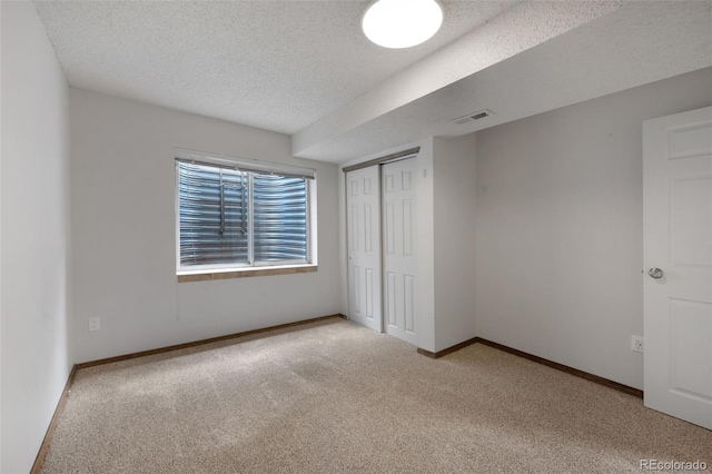 2859 Front Royal Dr, Colorado Springs, CO 80919 - unfurnished bedroom with carpet flooring, a textured ceiling, and a closet
