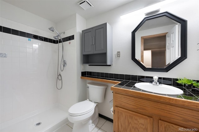 2859 Front Royal Dr, Colorado Springs, CO 80919 - full bath featuring vanity, a tile shower, and tile patterned floors
