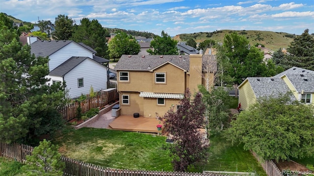 2859 Front Royal Dr, Colorado Springs, CO 80919 - rear view of house with a deck, stucco siding, and a residential view