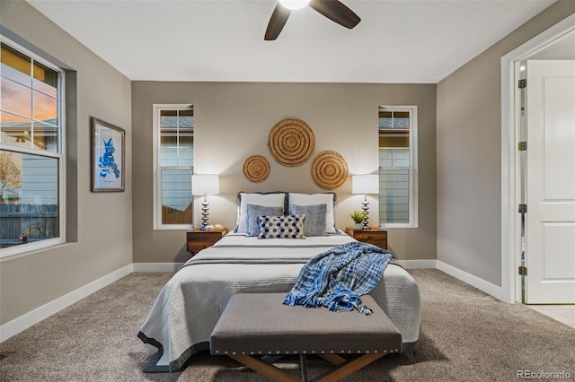 carpeted bedroom featuring ceiling fan and baseboards