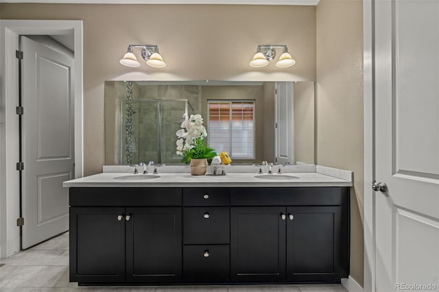 full bathroom with tile patterned floors, a sink, a shower stall, and double vanity