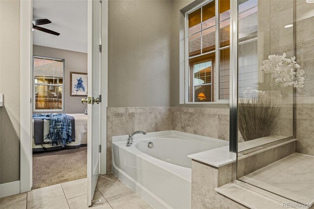 ensuite bathroom with tile patterned flooring, ensuite bath, and a bath