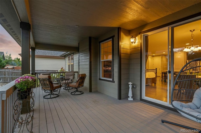 deck with outdoor dining area