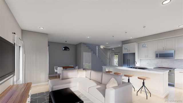 kitchen with sink and light hardwood / wood-style floors