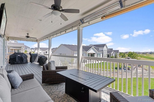 7074 S Vandriver Ct, Aurora, CO 80016 - wooden terrace with ceiling fan, a grill, a residential view, a lawn, and outdoor lounge area