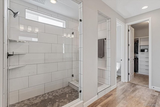 7074 S Vandriver Ct, Aurora, CO 80016 - bathroom featuring a stall shower, a spacious closet, wood finished floors, and recessed lighting