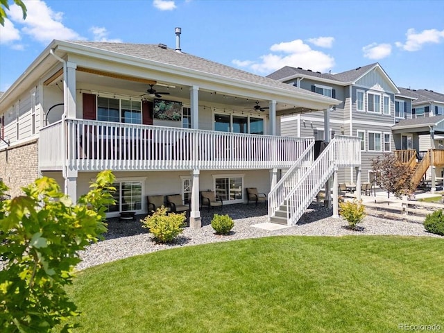7074 S Vandriver Ct, Aurora, CO 80016 - back of house with ceiling fan, stairway, a lawn, a deck, and a shingled roof