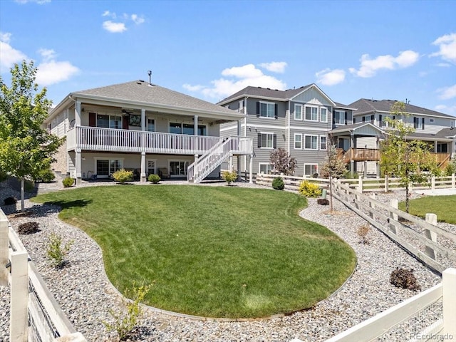 7074 S Vandriver Ct, Aurora, CO 80016 - back of property with stairs, ceiling fan, a wooden deck, and a residential view