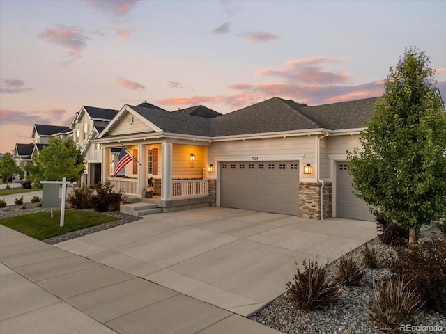 7074 S Vandriver Ct, Aurora, CO 80016 - view of front of home featuring a garage, a porch, and driveway
