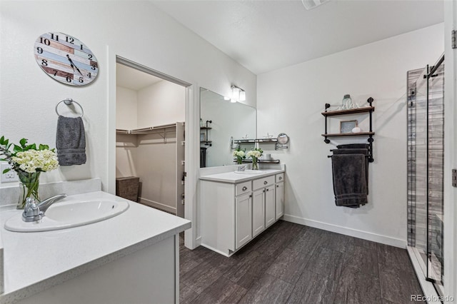 bathroom with hardwood / wood-style floors and vanity