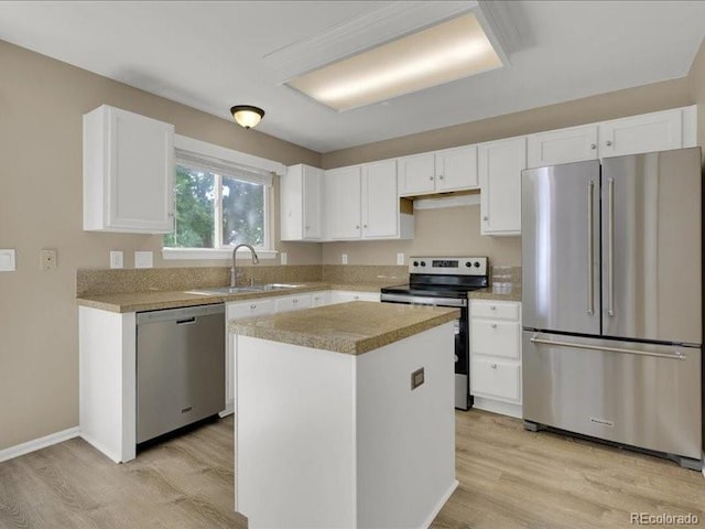 8906 Miners Dr, Highlands Ranch, CO 80126 - kitchen featuring stainless steel appliances, light wood-style floors, and white cabinetry
