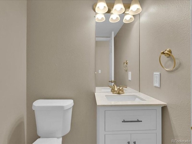 8906 Miners Dr, Highlands Ranch, CO 80126 - bathroom featuring vanity and a textured wall