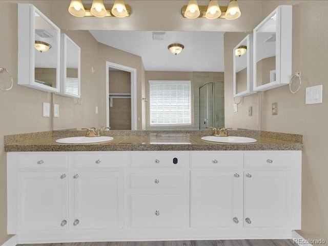 8906 Miners Dr, Highlands Ranch, CO 80126 - full bathroom featuring a stall shower and double vanity