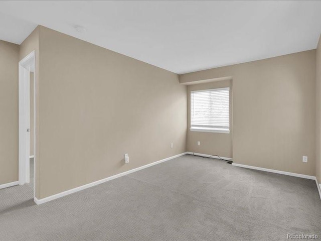 8906 Miners Dr, Highlands Ranch, CO 80126 - carpeted empty room with baseboards and a smoke detector