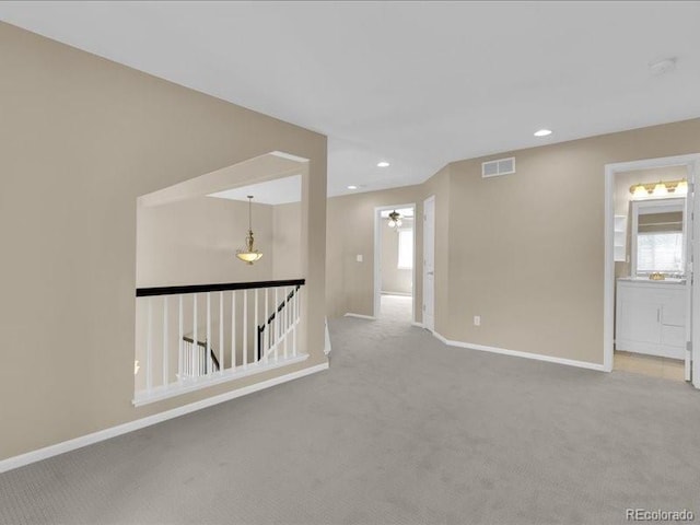 8906 Miners Dr, Highlands Ranch, CO 80126 - spare room featuring carpet floors, healthy amount of natural light, and recessed lighting