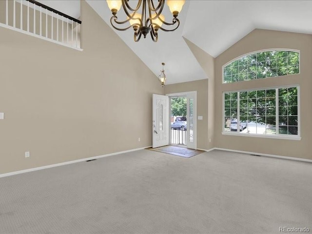 8906 Miners Dr, Highlands Ranch, CO 80126 - unfurnished living room featuring a chandelier, carpet, and high vaulted ceiling