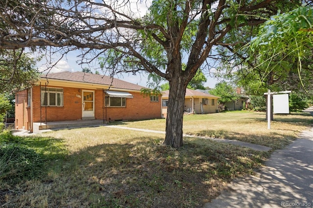 1585 S University Blvd, Denver, CO 80210 - view of front of home with brick siding and a front yard