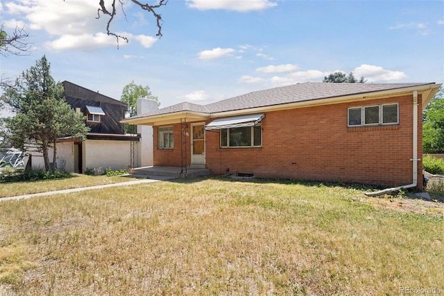 1585 S University Blvd, Denver, CO 80210 - view of front of house featuring a front lawn, brick siding, and an outdoor structure