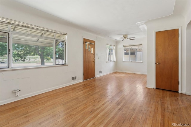1585 S University Blvd, Denver, CO 80210 - unfurnished living room featuring a ceiling fan and light wood-style flooring
