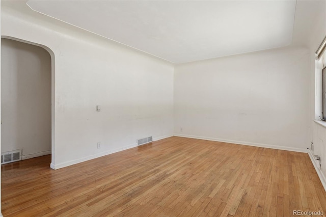 1585 S University Blvd, Denver, CO 80210 - unfurnished room featuring light wood-style flooring and arched walkways