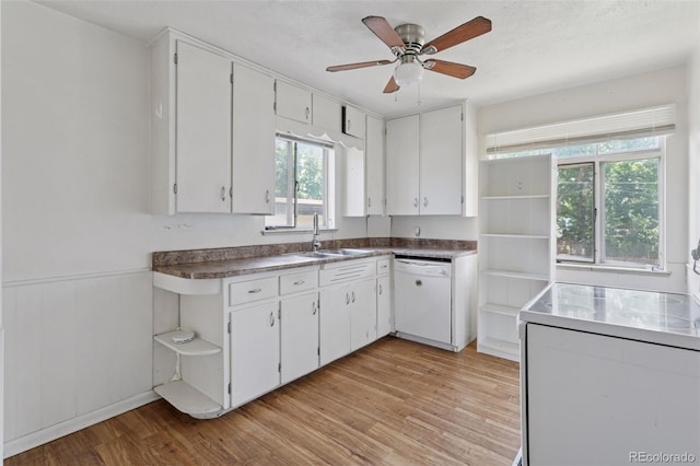 1585 S University Blvd, Denver, CO 80210 - kitchen with dishwasher, white cabinetry, light wood-style floors, and a wainscoted wall