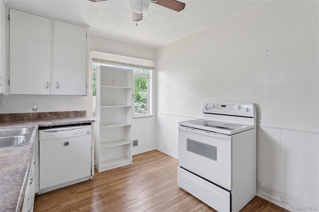 1585 S University Blvd, Denver, CO 80210 - kitchen featuring white appliances, light wood finished floors, a wainscoted wall, white cabinetry, and ceiling fan