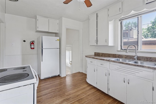 1585 S University Blvd, Denver, CO 80210 - kitchen featuring white appliances, white cabinets, a ceiling fan, light wood finished floors, and dark countertops