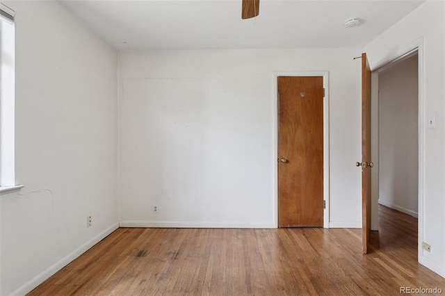 1585 S University Blvd, Denver, CO 80210 - unfurnished room featuring hardwood / wood-style floors, a ceiling fan, and a smoke detector