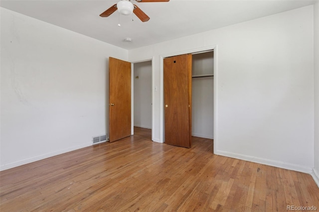 1585 S University Blvd, Denver, CO 80210 - unfurnished bedroom with light wood-type flooring, a closet, and a ceiling fan