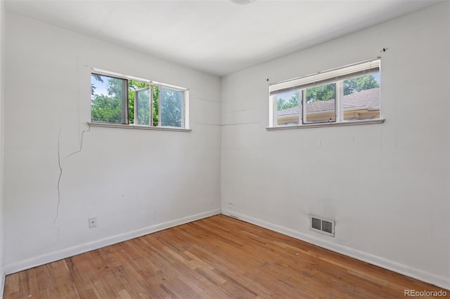 1585 S University Blvd, Denver, CO 80210 - spare room with wood finished floors and baseboards