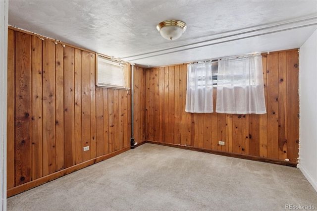 1585 S University Blvd, Denver, CO 80210 - spare room featuring carpet floors and wooden walls
