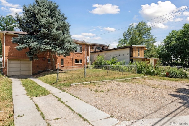 1585 S University Blvd, Denver, CO 80210 - view of front of property with driveway, a garage, and brick siding