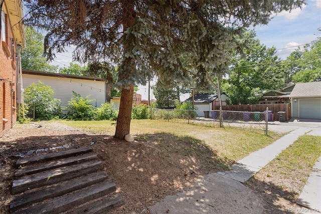 1585 S University Blvd, Denver, CO 80210 - view of yard with a garage