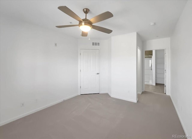 1062 Rockhurst Dr Unit 302, Highlands Ranch, CO 80129 - unfurnished bedroom with baseboards, carpet, and ceiling fan