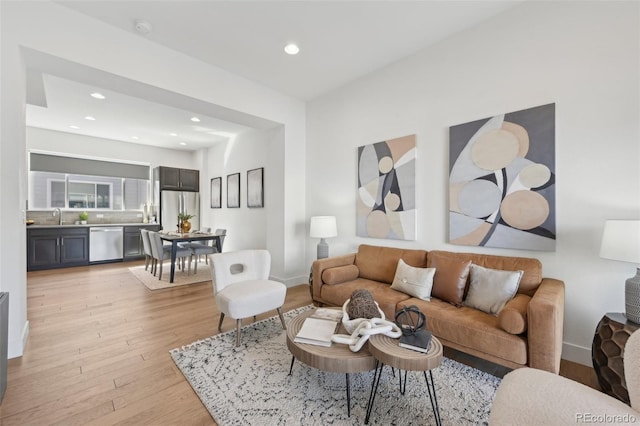 7812 W 43rd Pl, Wheat Ridge, CO 80033 - living area featuring light wood finished floors, recessed lighting, and baseboards