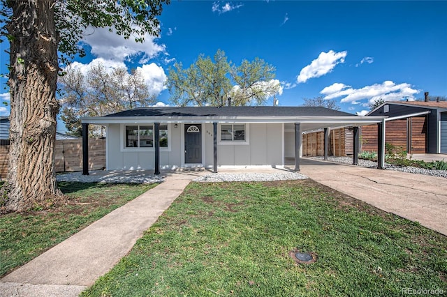 view of front of home featuring concrete driveway and an attached carport