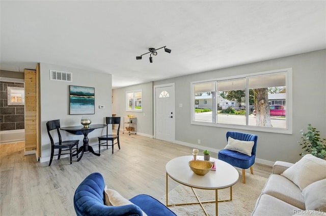 living area featuring wood finished floors and baseboards