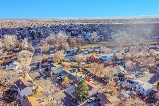 birds eye view of property with a residential view