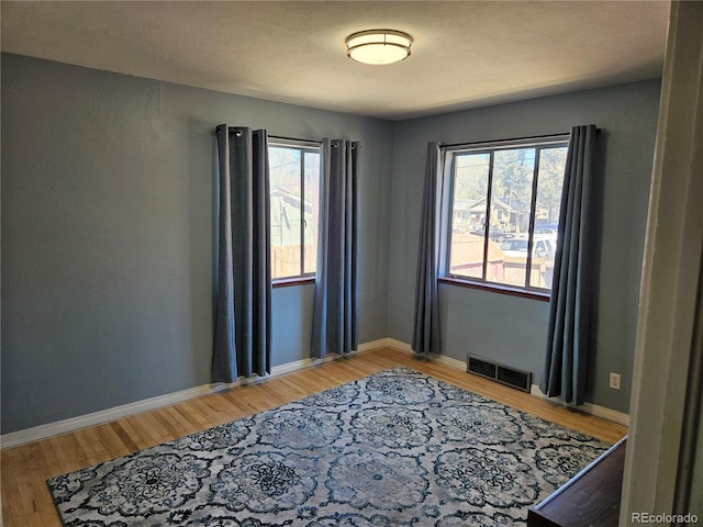 1822 E Pikes Peak Ave, Colorado Springs, CO 80909 - unfurnished room featuring light wood-style flooring and baseboards
