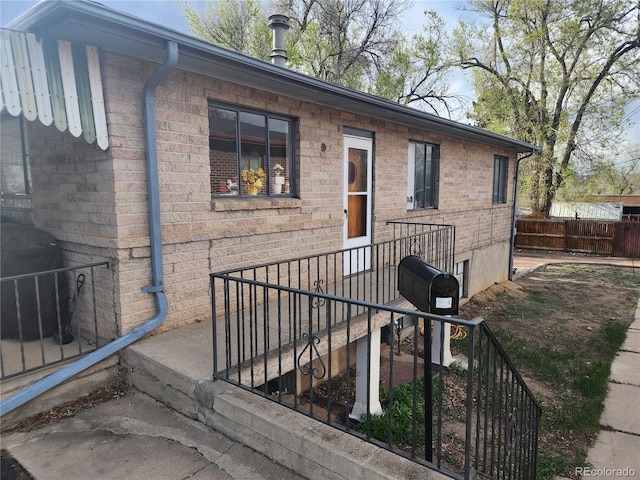 1822 E Pikes Peak Ave, Colorado Springs, CO 80909 - property entrance with fence and brick siding