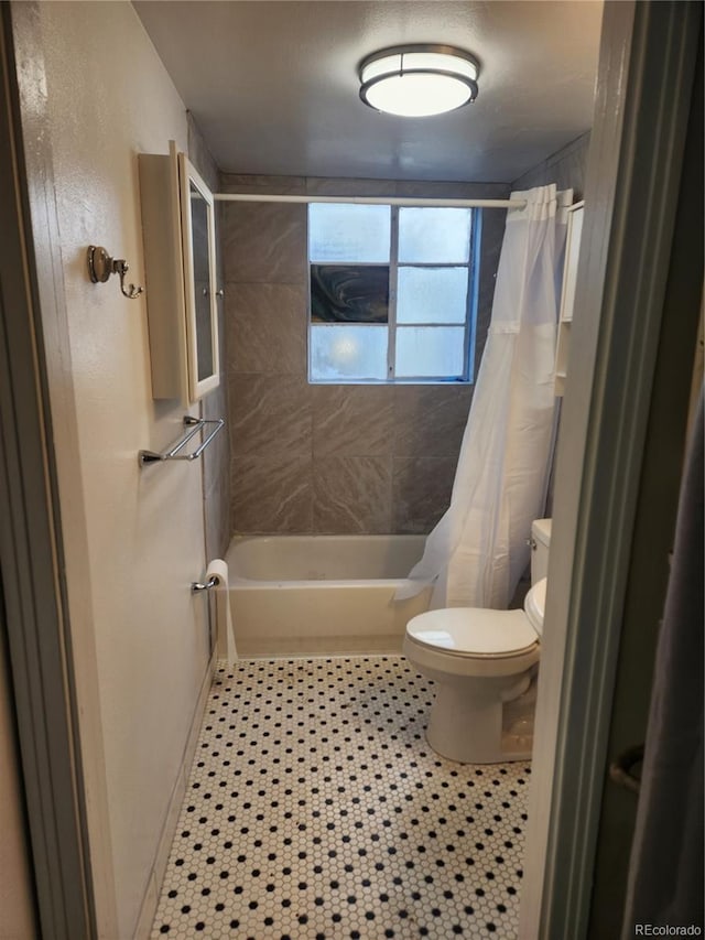1822 E Pikes Peak Ave, Colorado Springs, CO 80909 - full bath with toilet, shower / bathtub combination with curtain, and tile patterned flooring