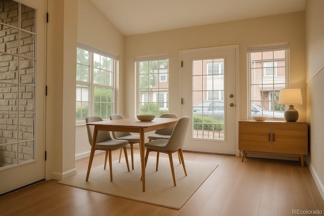 2980 W Centennial Dr Unit L, Littleton, CO 80123 - entryway with light wood-style flooring, baseboards, and vaulted ceiling