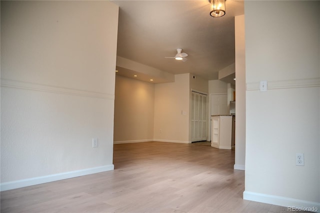 2980 W Centennial Dr Unit L, Littleton, CO 80123 - empty room with ceiling fan, light wood-style flooring, and baseboards