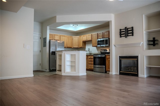 2980 W Centennial Dr Unit L, Littleton, CO 80123 - kitchen featuring appliances with stainless steel finishes, wood finished floors, built in shelves, and baseboards