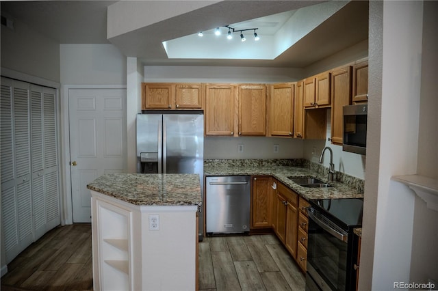 2980 W Centennial Dr Unit L, Littleton, CO 80123 - kitchen featuring appliances with stainless steel finishes, a sink, light wood-style floors, and stone counters